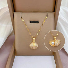 Elegant Gold Shell Pendant Necklace with Hidden Pearl