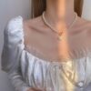 Vintage-Inspired Pearl Necklace with Heart Charm