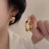 Modern Gold Crossover Hoop Earrings