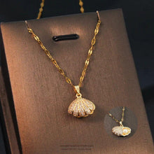 Elegant Gold Shell Pendant Necklace with Hidden Pearl