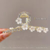 Floral Rhinestone Clutcher – Elegant Pearl Blossom Design for Updos