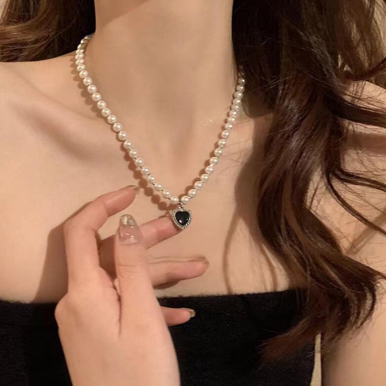 Elegant Pearl Necklace with Black Heart Pendant